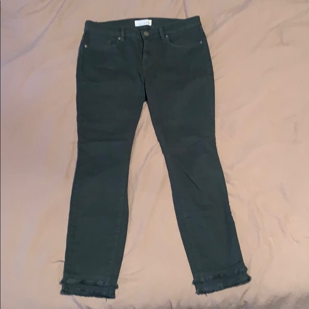 Dark teal skinny jeans with layered ankle frray